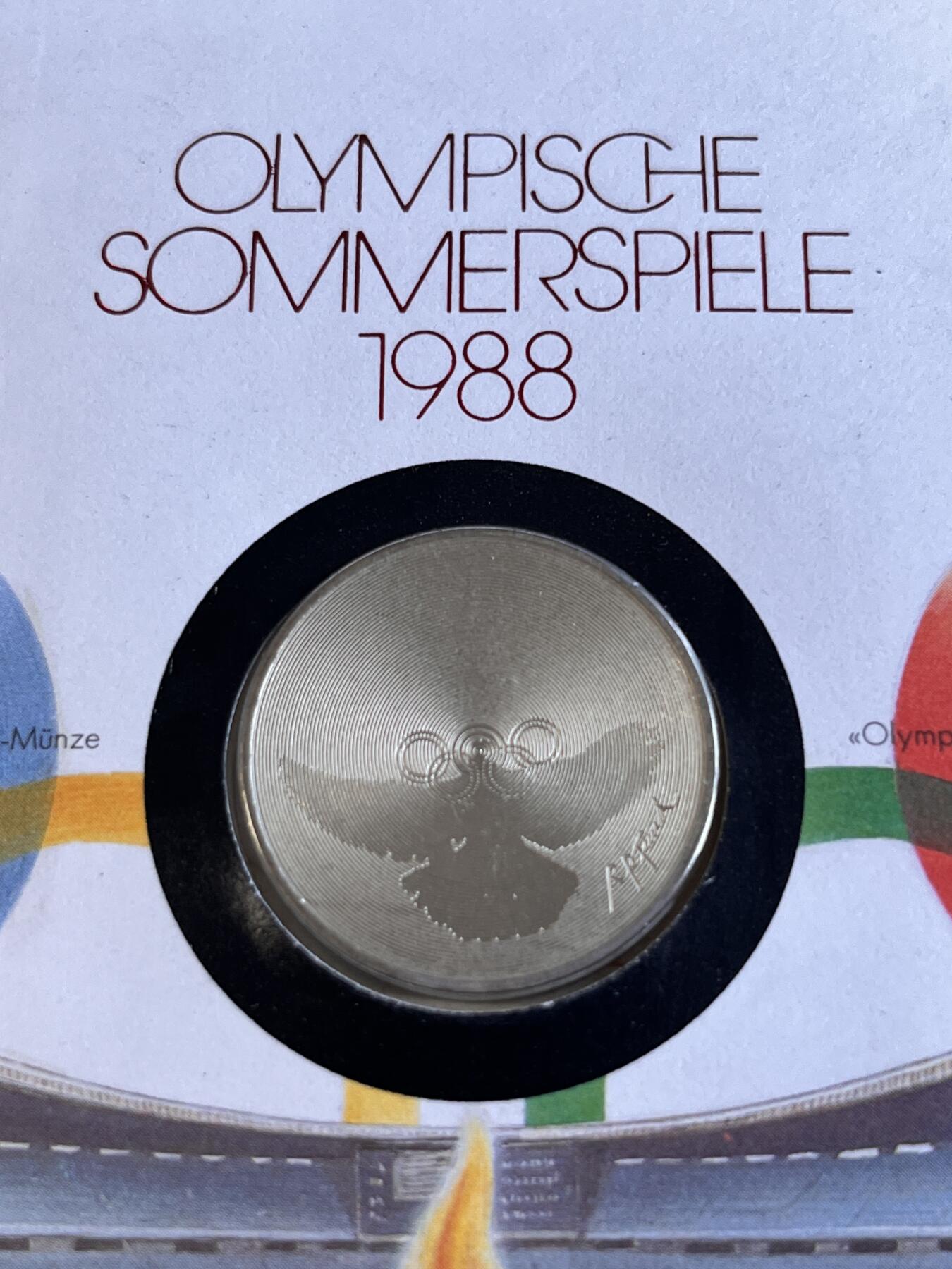 第166期拍卖【长期征集拍品】 获奖瑞士1988年汉城奥运和平鸽和五环纪念币首日封，获得克劳斯1990年度最佳艺术币大奖。