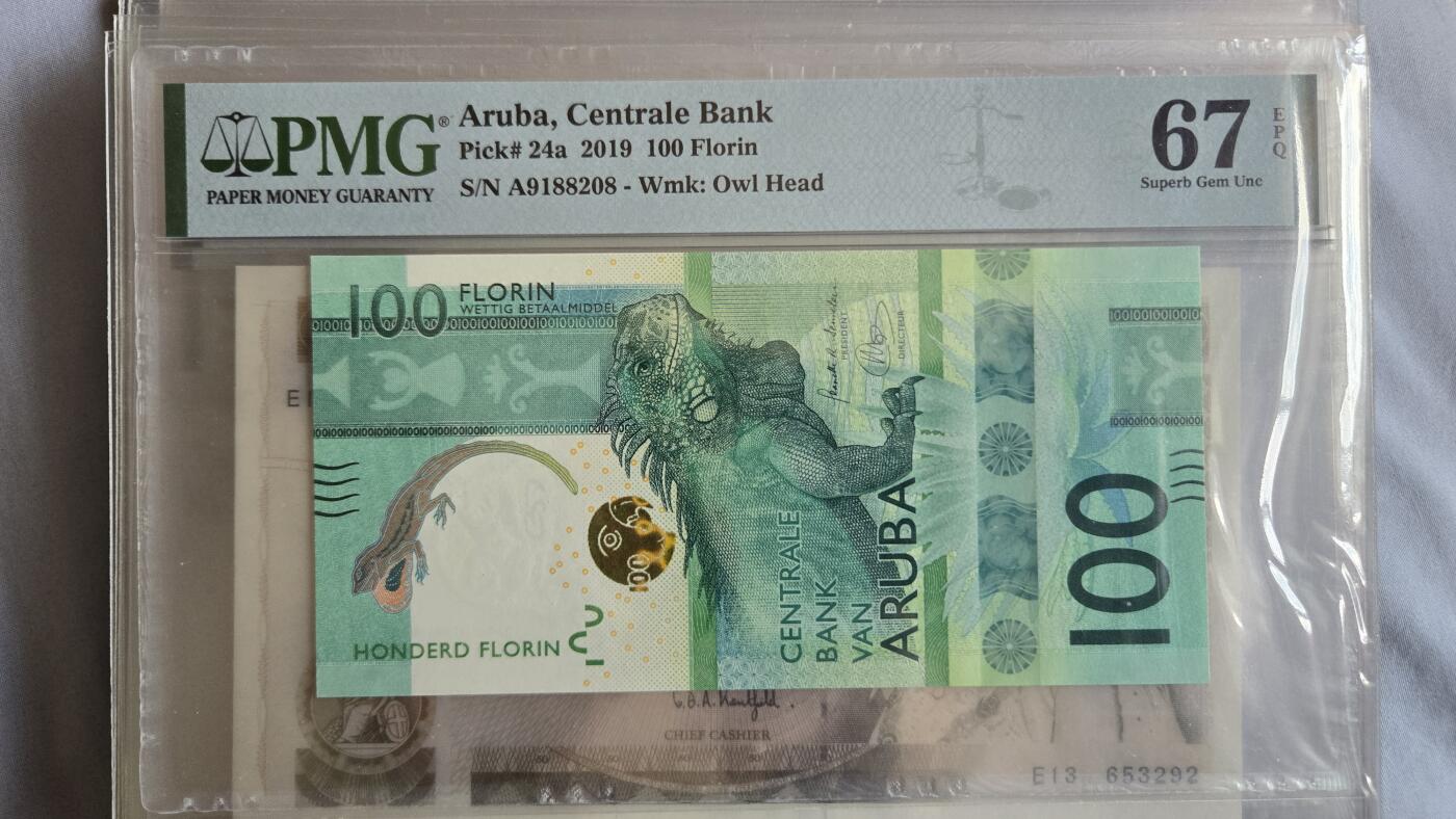 听雨轩外币专场（7） 阿鲁巴100弗洛林  pmg67   ibns2019最佳纸币  首发A冠  朦胧号尾8