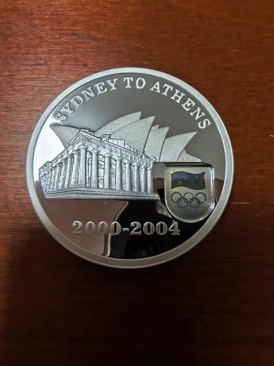 长老汇蛇年精选第二十四场拍卖 - 2004澳大利亚悉尼交接雅典5元精制银币，右下角全息，36.31克999银，1.5万枚，盒证全