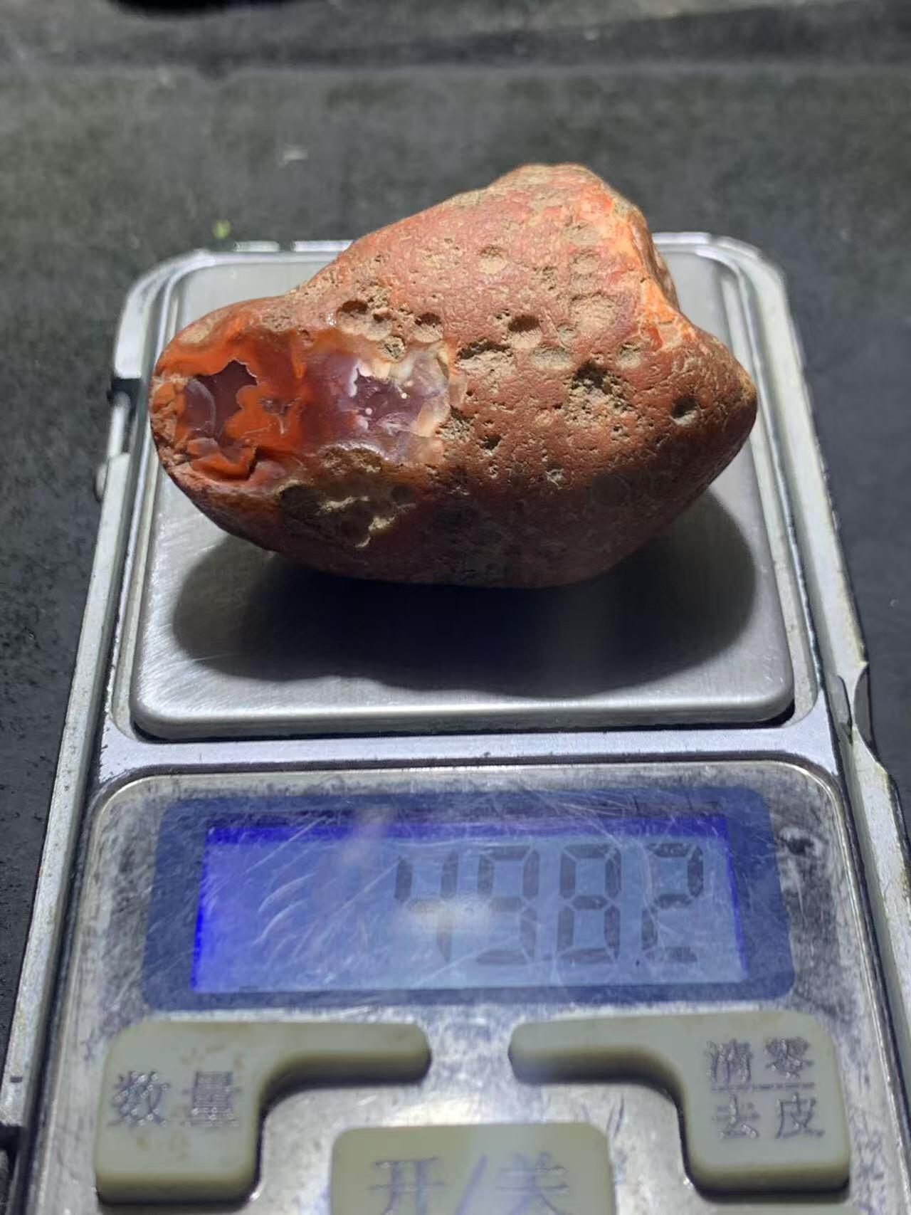 精美川料红皮开窗柿子红紫罗兰南红玛瑙原石一颗