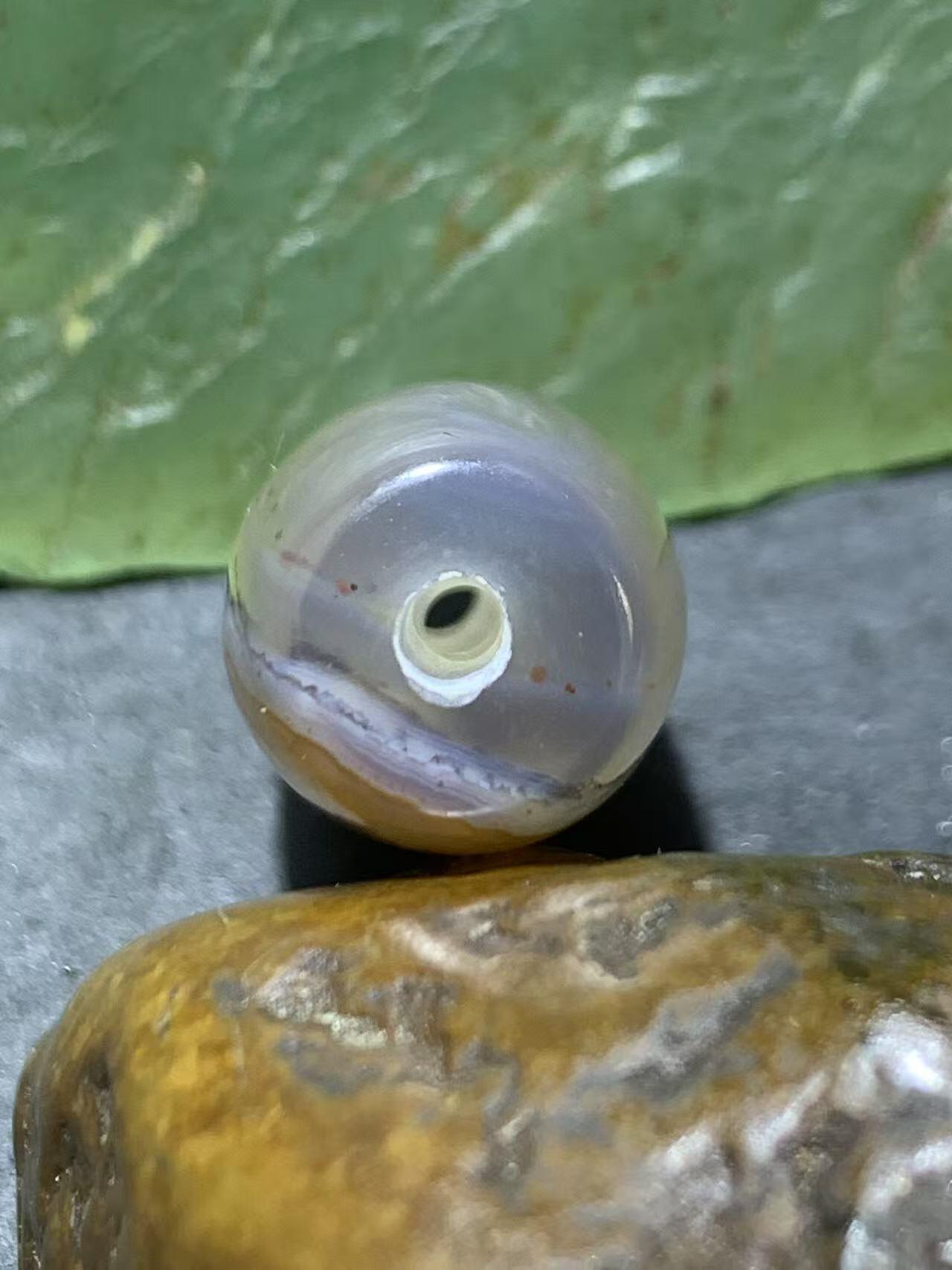 精美天然高玉化朱砂点天眼纹巴西玛瑙随形桶珠一颗