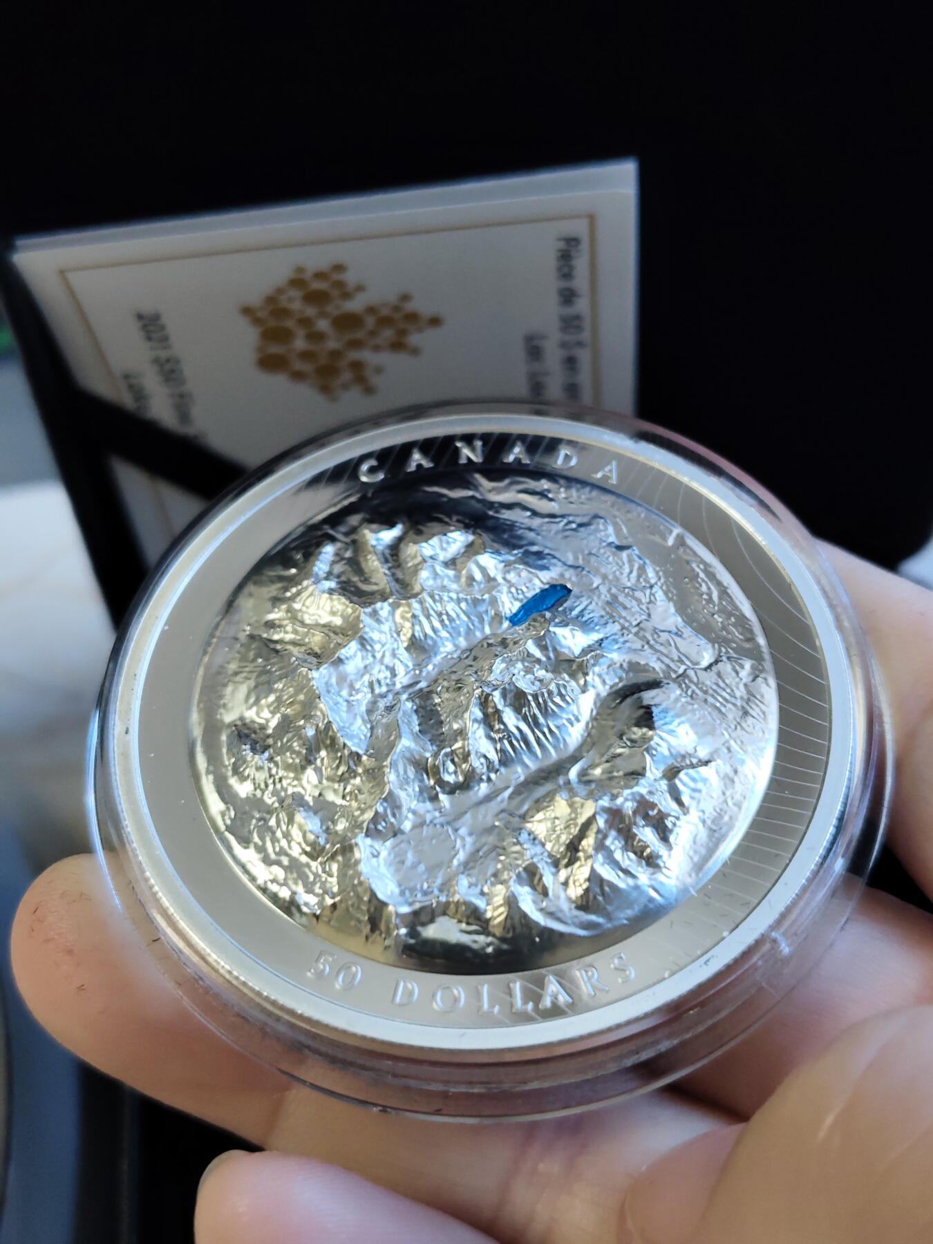 第168期拍卖【长期征集拍品】 加拿大2021年落基山脉明珠路易斯湖潮高浮雕银币，9999银，发行3000枚，边齿有氧化
