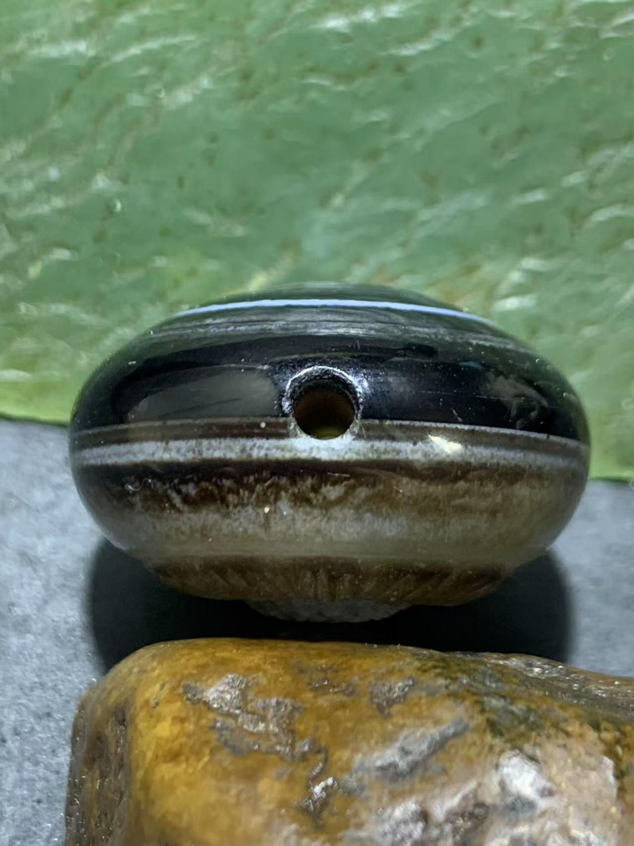 精品天眼纹药师玛瑙手工雕刻太阳花板珠（背云）一颗。