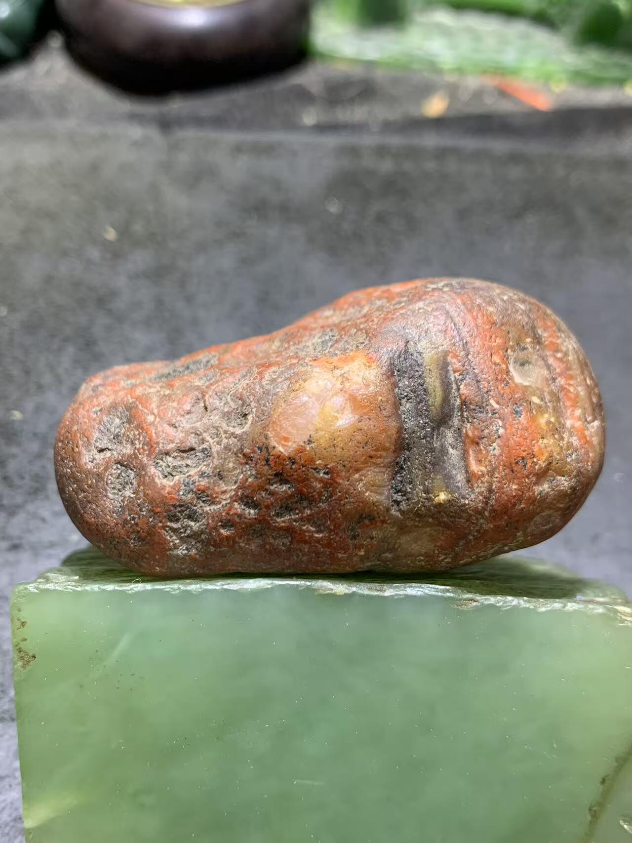 精美冰飘红皮开窗料柿子红冻料南红玛瑙原石一颗，