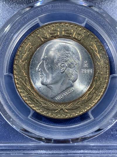 《竞宝斋》第406场 周日，周一，2场连拍 （全场包邮） PCGS MS63 墨西哥1994年20比索 少见内圈银芯 双色币 这枚细节清晰 两面转光品相 有点低评了 难得一遇的东西