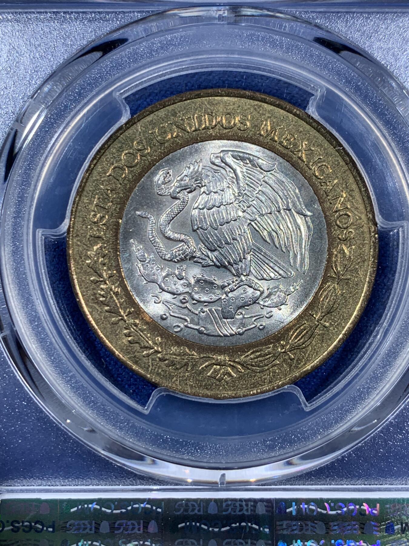 《竞宝斋》第406场 周日，周一，2场连拍 （全场包邮） PCGS MS63 墨西哥1994年20比索 少见内圈银芯 双色币 这枚细节清晰 两面转光品相 有点低评了 难得一遇的东西