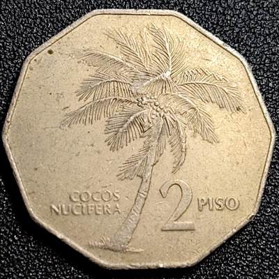 泉币菌-第72场-精品欢乐场-第5场 / 福利放送，感谢大家一直以来的支持。68-72场中，凡拍中15单及以上者，非偏远地区购买者，其所购所有商品满30包邮。       （特别说明：偏远地区包邮条件除满足购满15单及以上外，内蒙古、青海、西藏、宁夏需要满48包邮，新疆、西藏需要满68包邮。） - 1985年 菲律宾2比索大币 波尼法西奥将军大版 棕榈树 31毫米12克 多边形异形币 