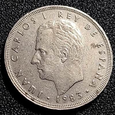 泉币菌-第68场-精品欢乐场-第1场 / 福利放送，感谢大家一直以来的支持。68-72场中，凡拍中15单及以上者，非偏远地区购买者，其所购所有商品满30包邮。       （特别说明：偏远地区包邮条件除满足购满15单及以上外，内蒙古、青海、西藏、宁夏需要满48包邮，新疆、西藏需要满68包邮。） 西班牙1983年 5比塞塔镍币 卡洛斯一世 23mm  西班牙国徽