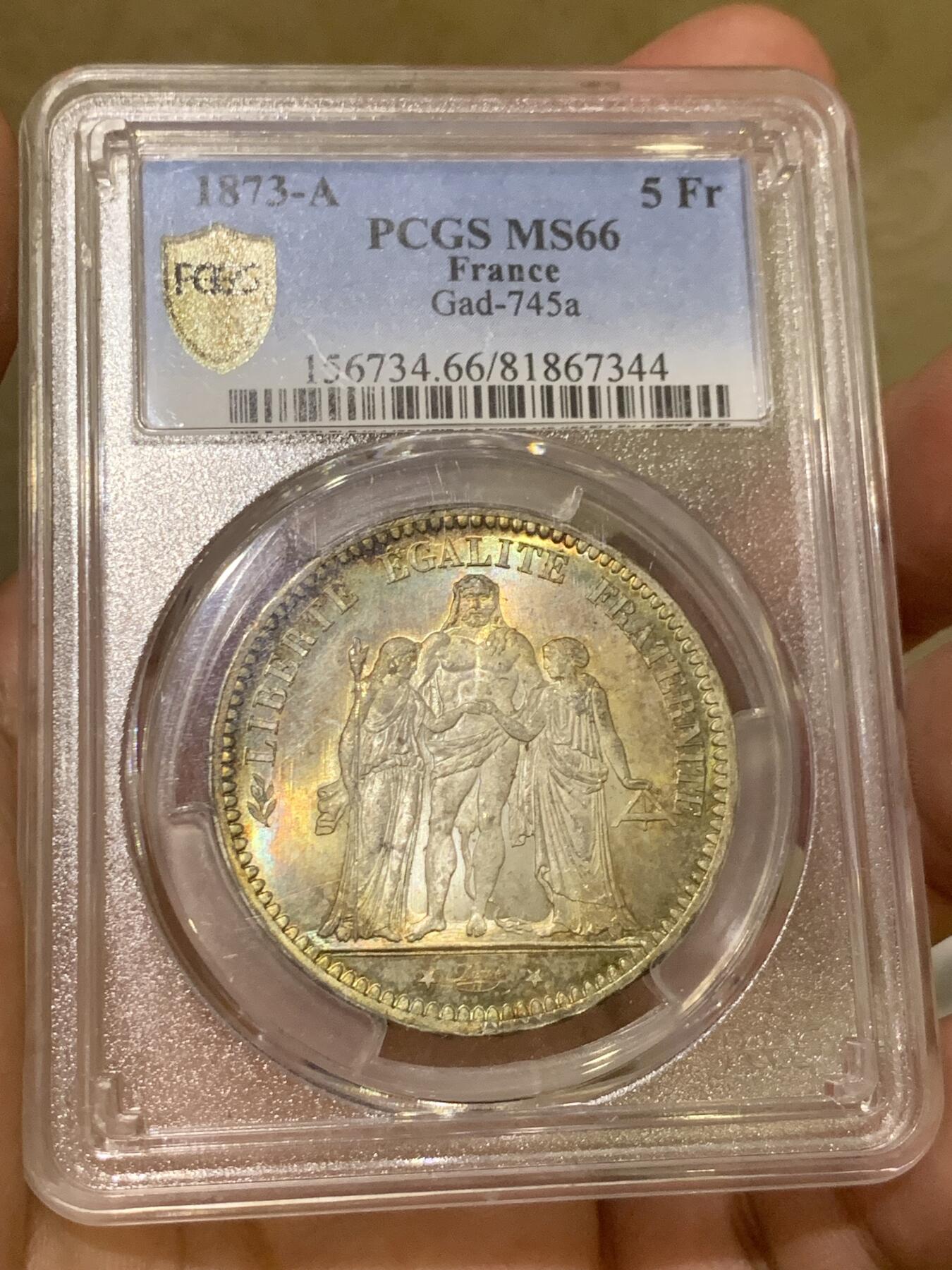 《竞宝斋》第407场 周日，周一，2场连拍 （全场包邮） PCGS MS66 法国1873年大力神5法郎银币，该版本最高分67分，这枚细节完美，正反面细节突出，视线所及之处皆为五彩，难得藏品。