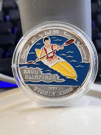第169期拍卖【长期征集拍品】 - 西撒哈拉1997年悉尼奥运皮划艇彩色珐琅纪念银币，999银，20克，有氧化