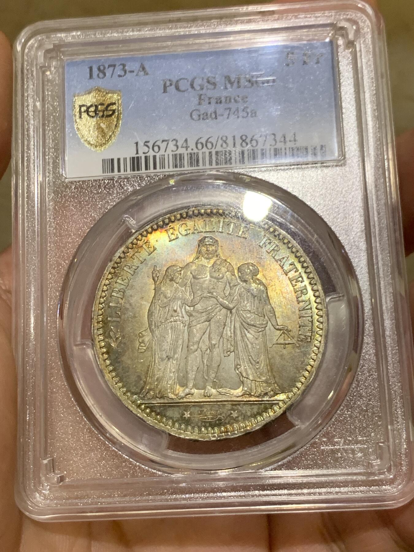 《竞宝斋》第407场 周日，周一，2场连拍 （全场包邮） PCGS MS66 法国1873年大力神5法郎银币，该版本最高分67分，这枚细节完美，正反面细节突出，视线所及之处皆为五彩，难得藏品。