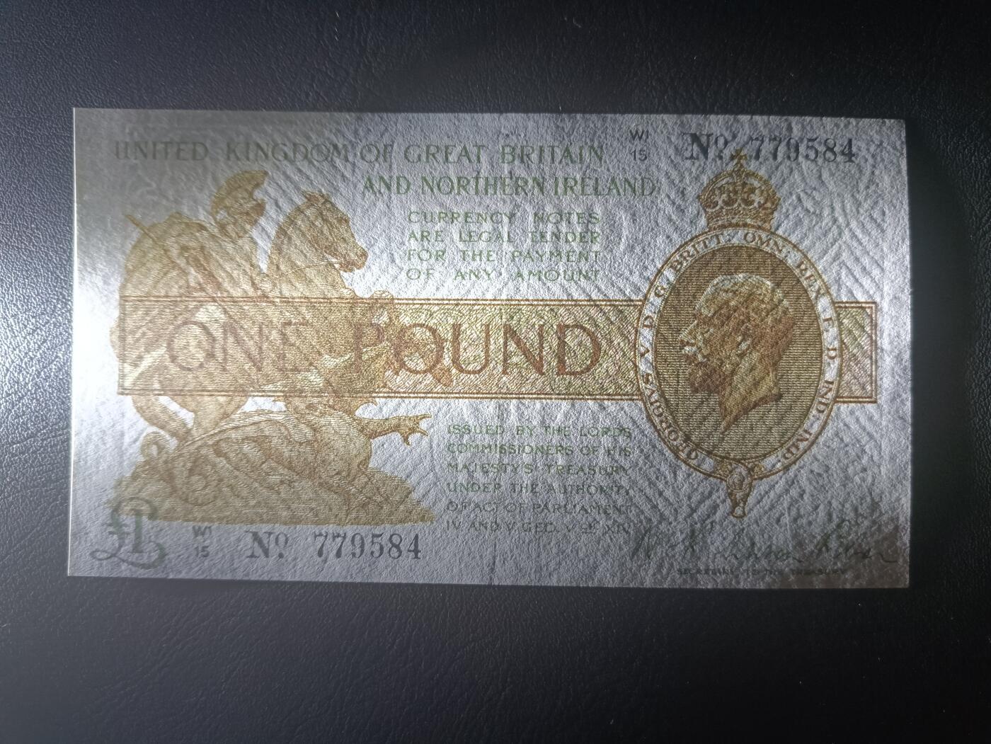 2025八月第二期（总187期） 英格兰1928版1镑AUNC有针孔，乔治五世国王圣乔治屠龙和威斯敏斯特议会