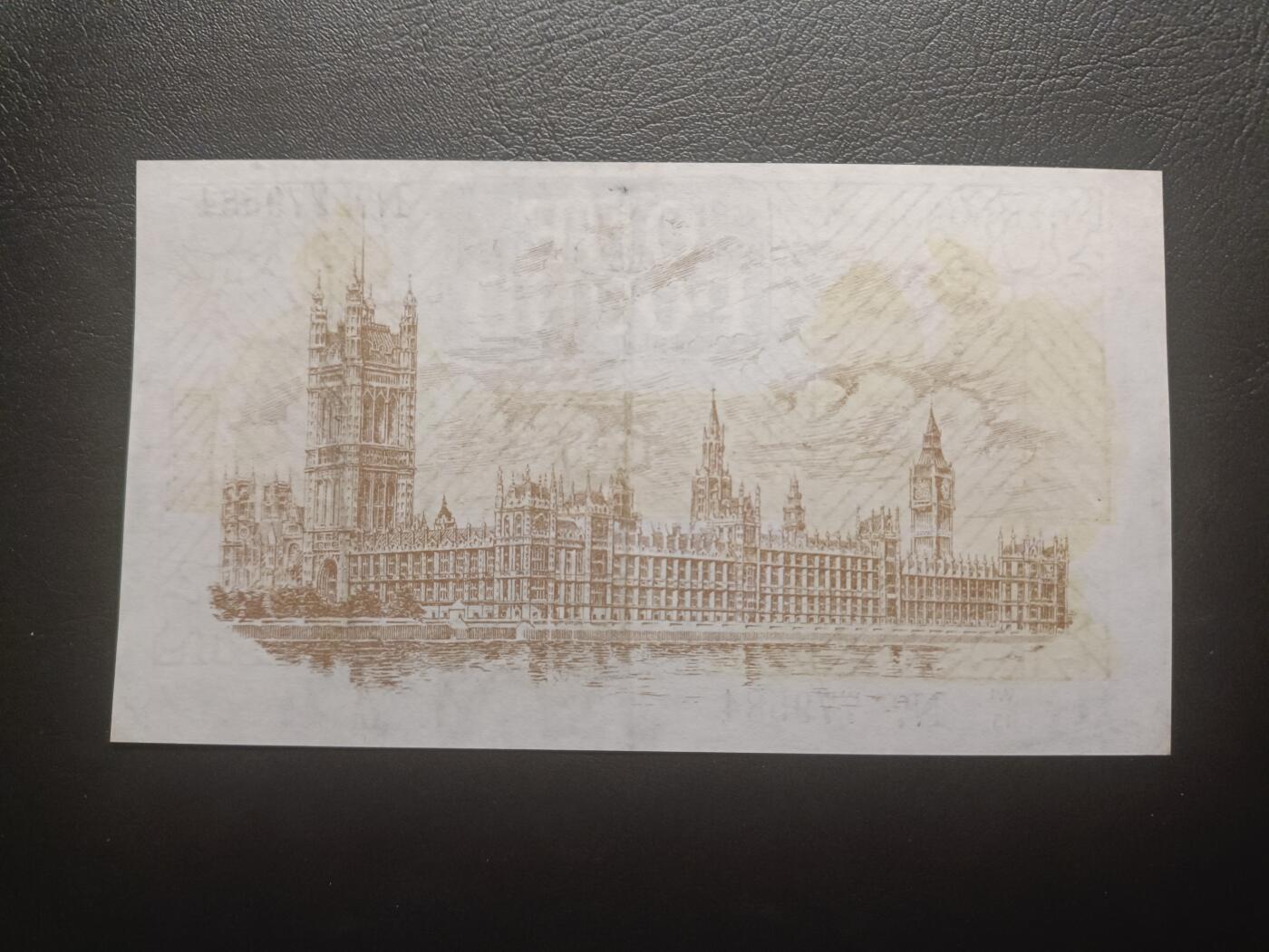 2025八月第二期（总187期） 英格兰1928版1镑AUNC有针孔，乔治五世国王圣乔治屠龙和威斯敏斯特议会