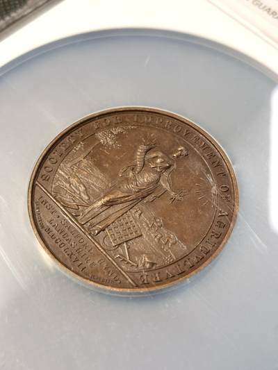 甄臻铺-世界币章拍卖（第28期），送拍享返佣金等优惠多多 NGC-MS63BN 1922年英国兰开夏农业学会Royal Lancashire Agricultural Society铜章，正面刻有英国皇家徽章和狮子独角兽图案，背面是农业女神手持麦穗和太阳光芒，环绕着