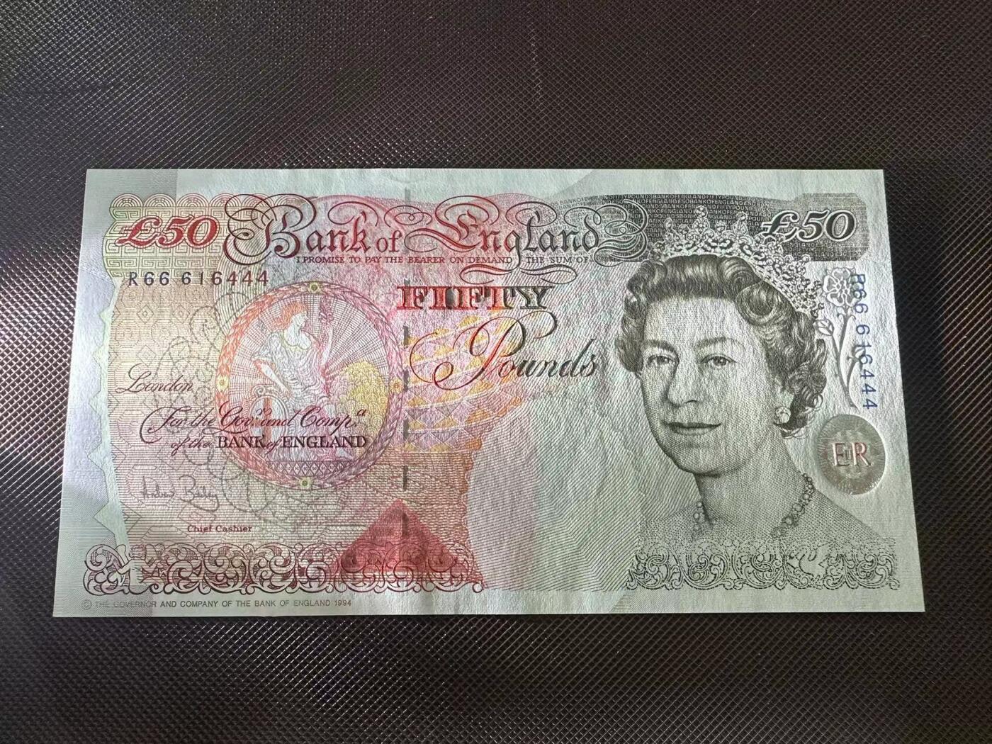 喜羊羊钱币收藏2025第8期(普品场) 英国2006年 unc 号码r66616444  豹子头 豹子尾