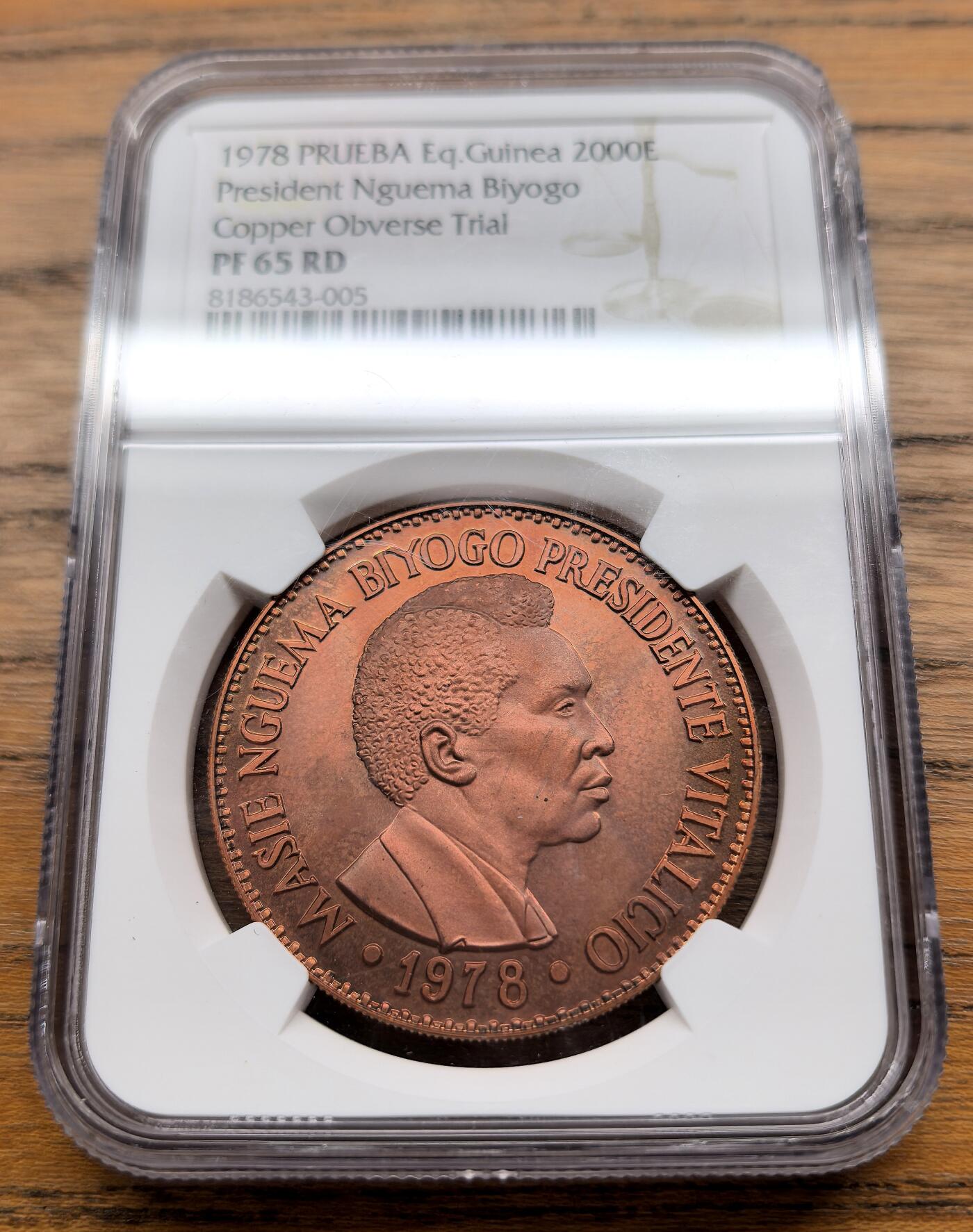 凡希社世界钱币微拍第三百零九期 1978赤道几内亚总统恩圭马比约戈2000E铜样币NGC-PR65，赤道几内亚第一任总统、政治家、独裁者，非洲民族解放运动的元老，1968年10月12日—1979年8月3日执政。