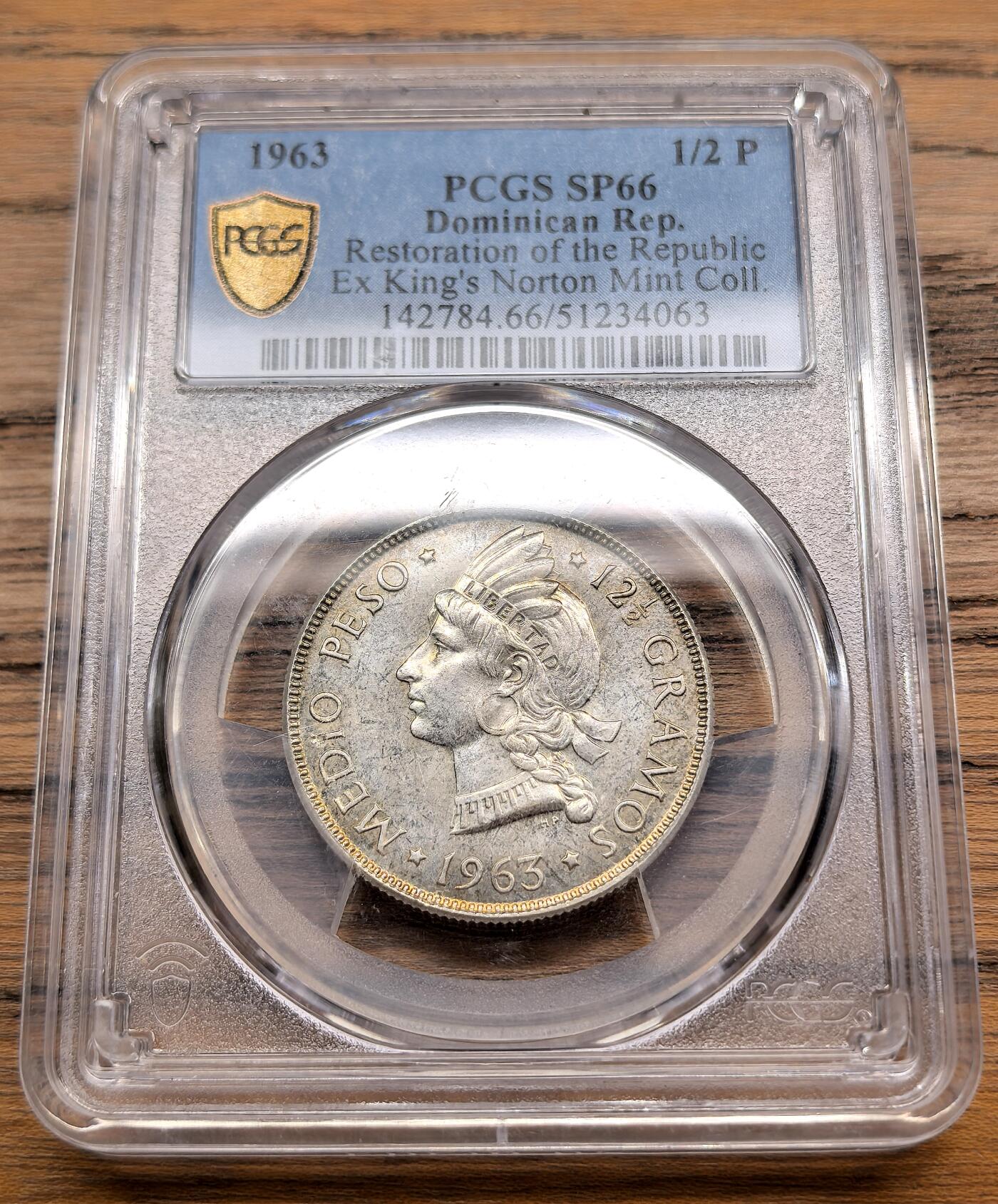 凡希社世界钱币微拍第三百零九期 1963多米尼加共和国的恢复纪念1/2比索银币PCGS-SP66，King's Norton留厂样币。