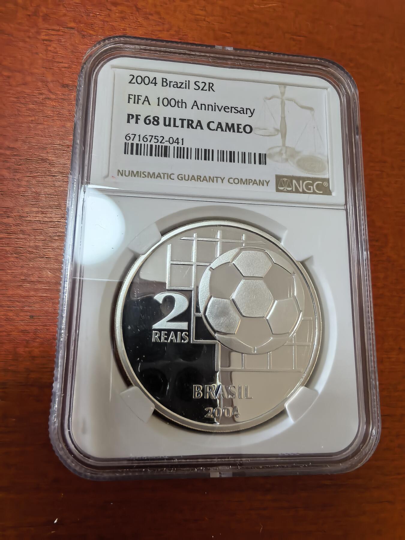 长老汇蛇年精选第三十六场拍卖 2004 巴西世界杯百周年2里亚尔精制银币，NGC PF68UC，更高25枚，12166枚，克书价高