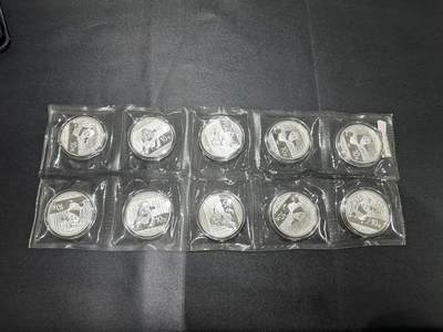 《外钞收藏家》第五百五十六期（本期有精品评级币、裸币、银币等）（本平台长期征集拍品、欢迎藏友们联系合作） - 2014年熊猫银 十枚一起 银行原封 全新