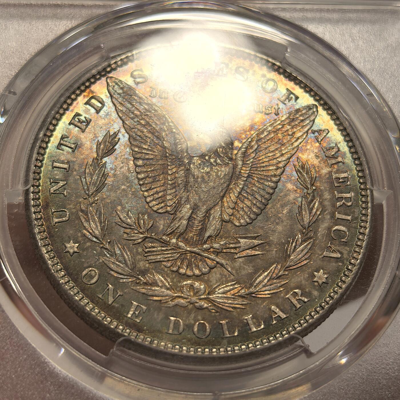 博洋堂世界钱币拍卖第135期（全场包邮）【请留意本场发货时间变化】 美国1885年摩根银币P版PCGS-MS65，原汁原味双面五彩老包浆，包浆醇厚润泽又犀利，打制深峻，转光强烈细节优秀，状态一流。