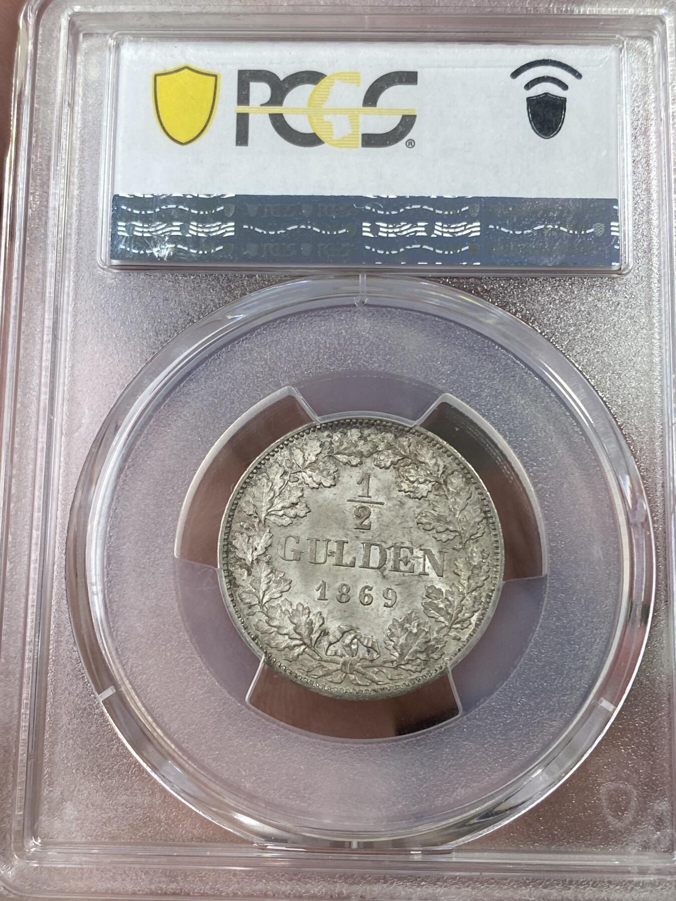 万国钱币拍卖第051期 PCGS MS64 1869德国巴伐利亚路德维希二世1/2古尔登银币 原味纸袋包浆 小中见大的顶级收藏品质