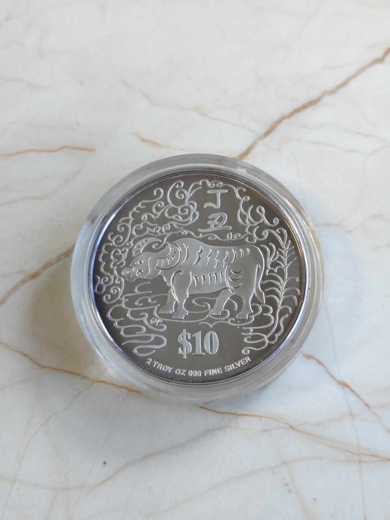 第171期拍卖【长期征集拍品】 新加坡1997年十二生肖已丁丑牛年2盎司纪念银币，999银，有氧化，材料价大致545元左右