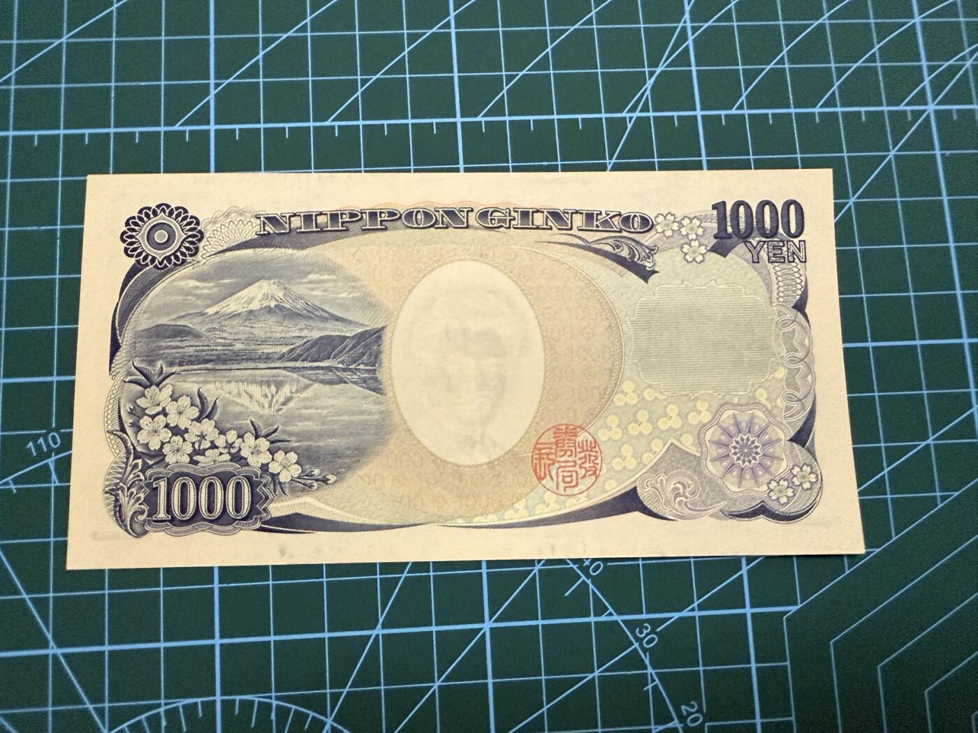 【炜奕收藏】，第四十一期 日本野口英世1000元，UNC-品相，蓝色单字轨，水印处有轻微压痕