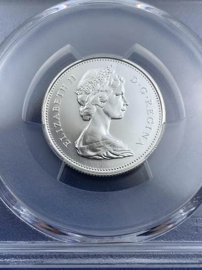 《竞宝斋》第409场 周日，周一，2场连拍 （全场包邮） PCGS PL66 高分 1967年加拿大建国百年纪念25分 非常漂亮的白币 币面光洁 浮雕感很强 豹子图案