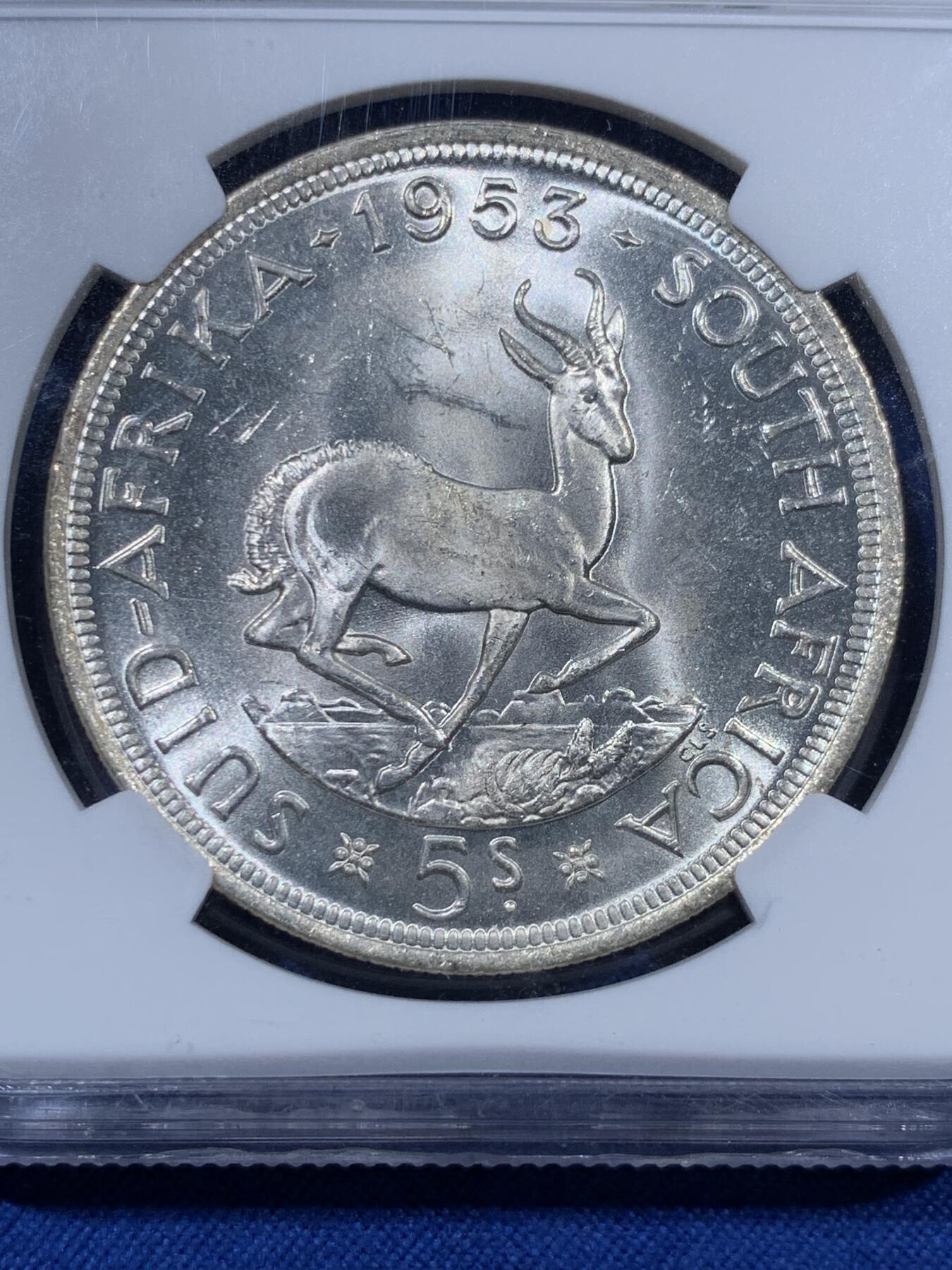 《竞宝斋》第409场 周日，周一，2场连拍 （全场包邮） NGC MS63 英属南非1953年伊丽莎白二世跳羚羊版5先令银币，车轮十字转光，币面清爽干净又漂亮，状态极佳。