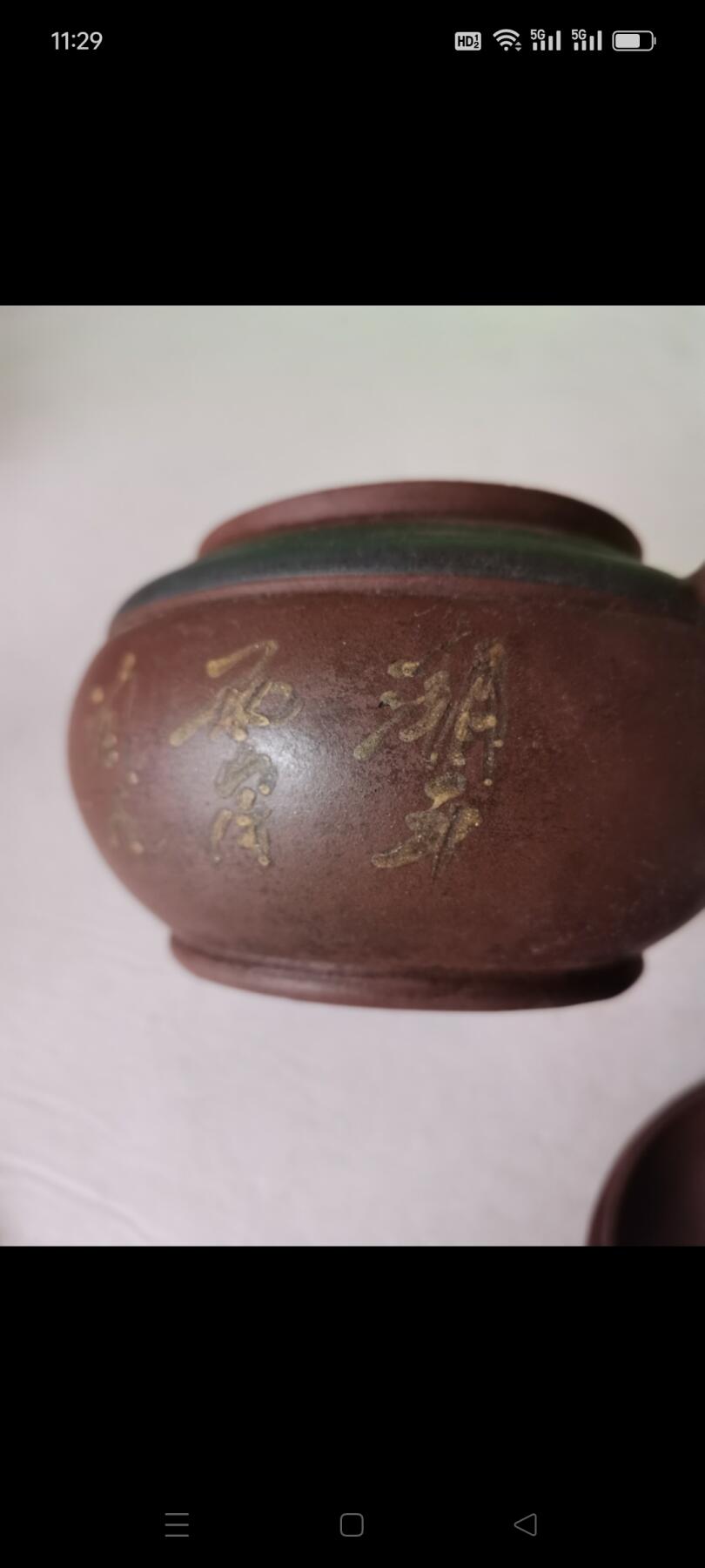 几十年前的紫砂壶1把。有画和诗词，砂质好，使用痕迹明显，完整如图包老