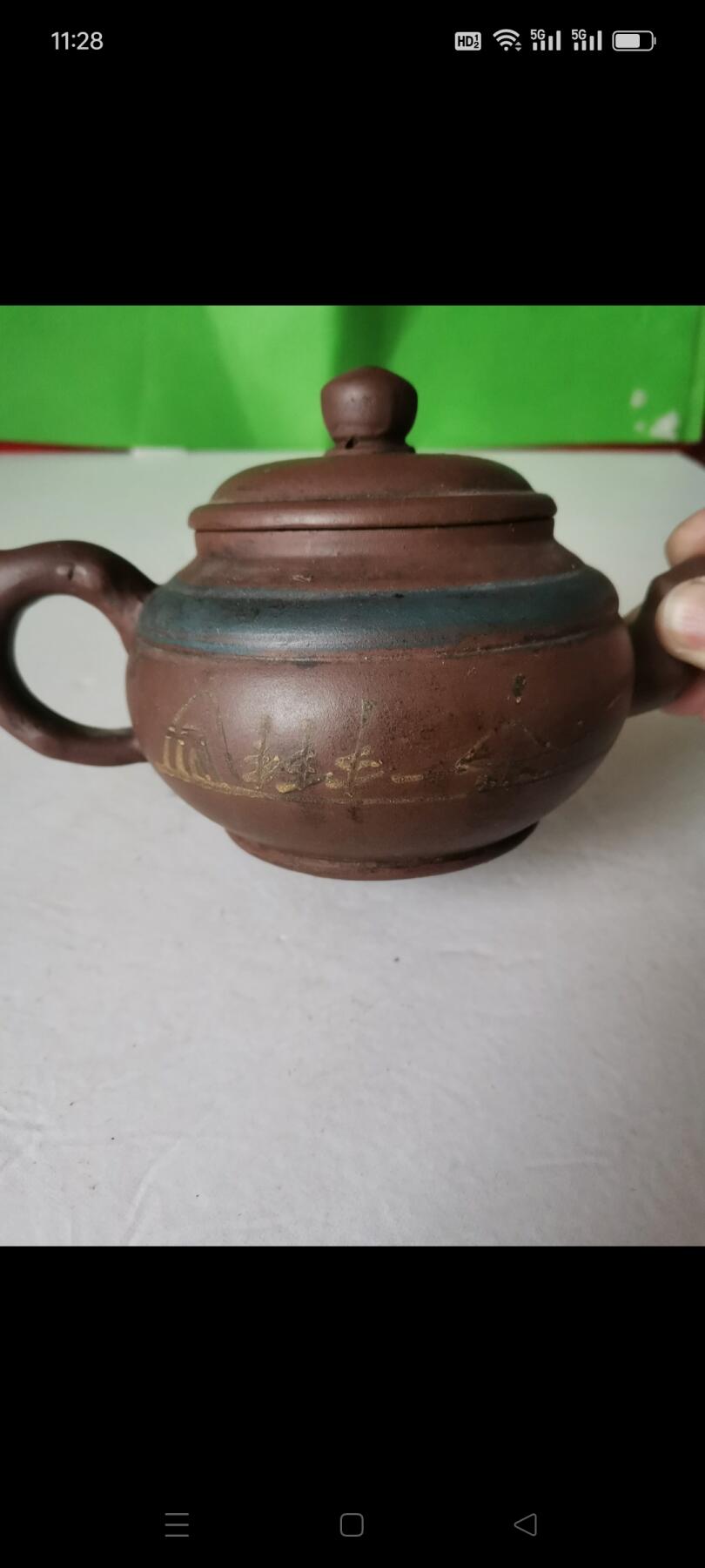 几十年前的紫砂壶1把。有画和诗词，砂质好，使用痕迹明显，完整如图包老
