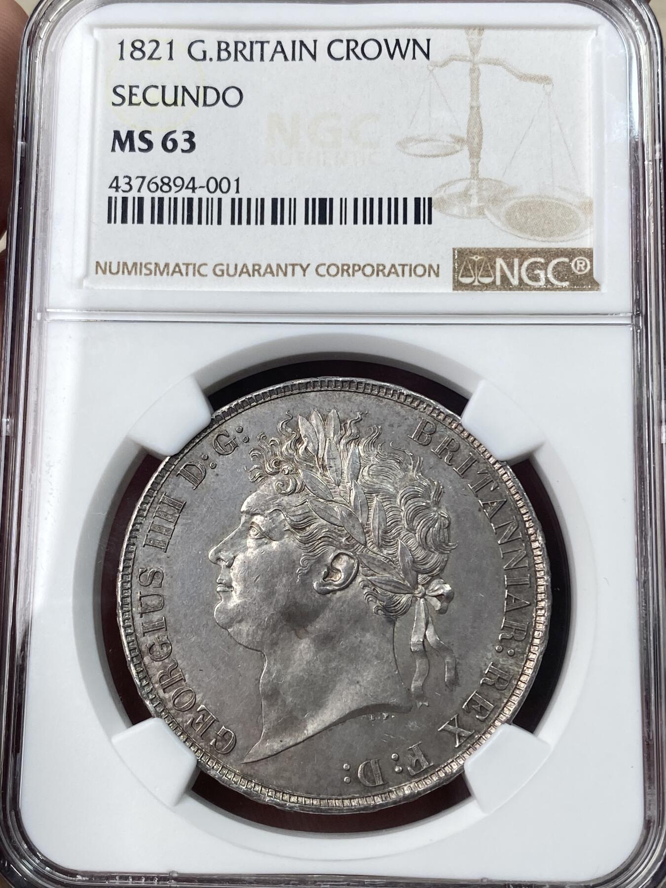 万国钱币拍卖第051期 NGC MS63 1821英国乔治四世马剑克朗 英国马剑系列中不可或缺的力作 Pistrucci倾力之作 优雅铁灰包浆 车轮转光 好品难得的一枚马剑大银