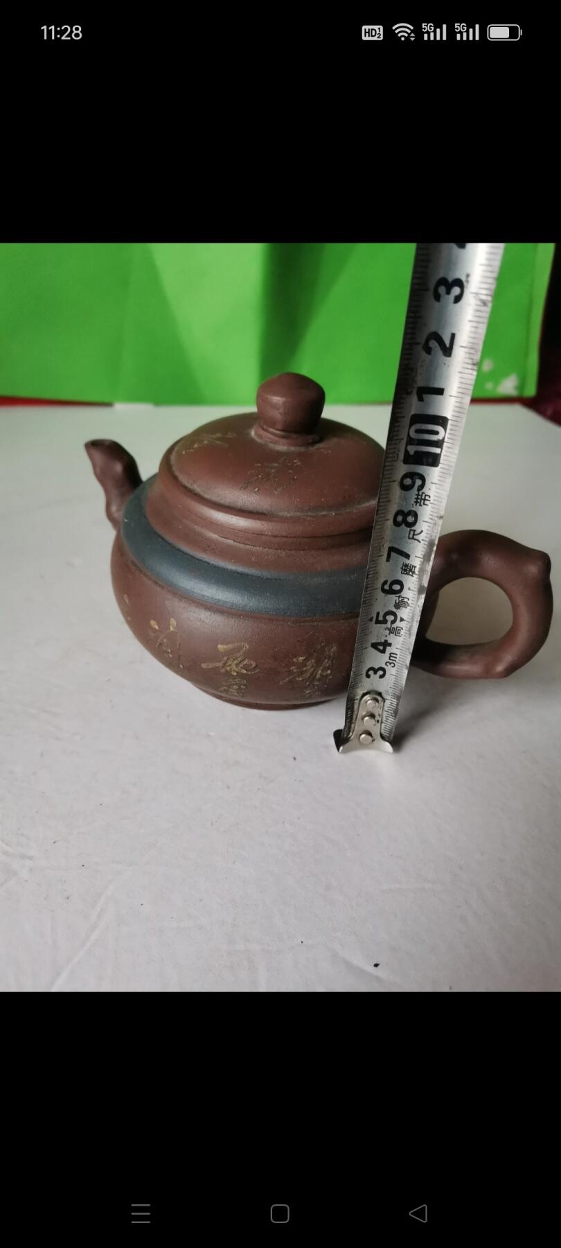 几十年前的紫砂壶1把。有画和诗词，砂质好，使用痕迹明显，完整如图包老