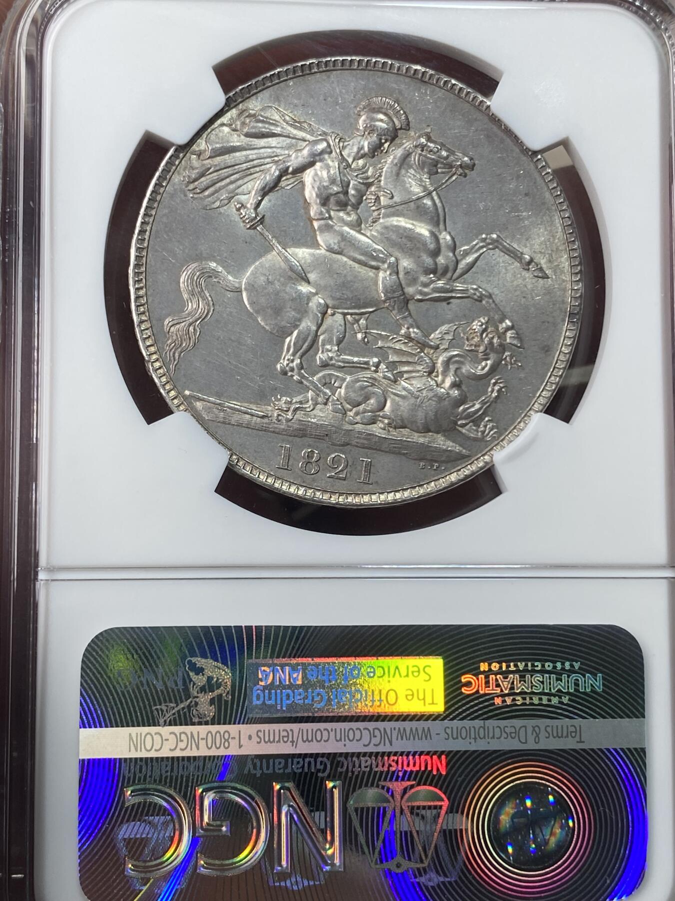 万国钱币拍卖第051期 NGC MS63 1821英国乔治四世马剑克朗 英国马剑系列中不可或缺的力作 Pistrucci倾力之作 优雅铁灰包浆 车轮转光 好品难得的一枚马剑大银