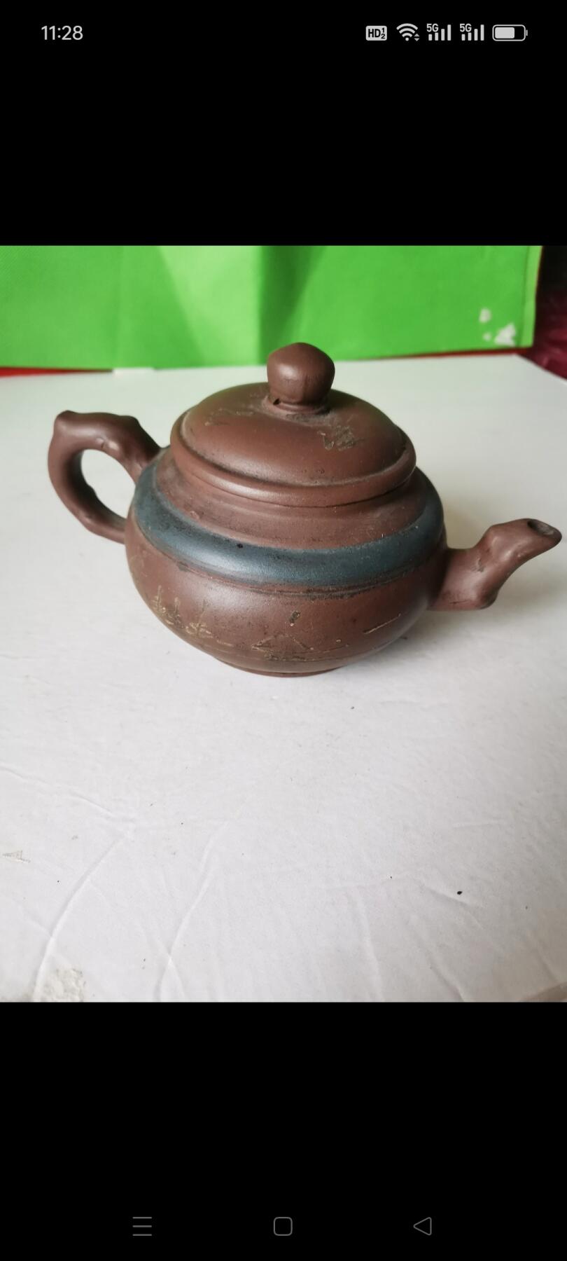 几十年前的紫砂壶1把。有画和诗词，砂质好，使用痕迹明显，完整如图包老