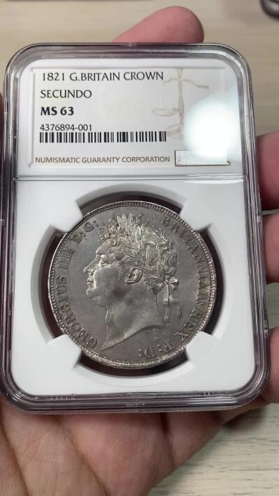 万国钱币拍卖第051期 NGC MS63 1821英国乔治四世马剑克朗 英国马剑系列中不可或缺的力作 Pistrucci倾力之作 优雅铁灰包浆 车轮转光 好品难得的一枚马剑大银