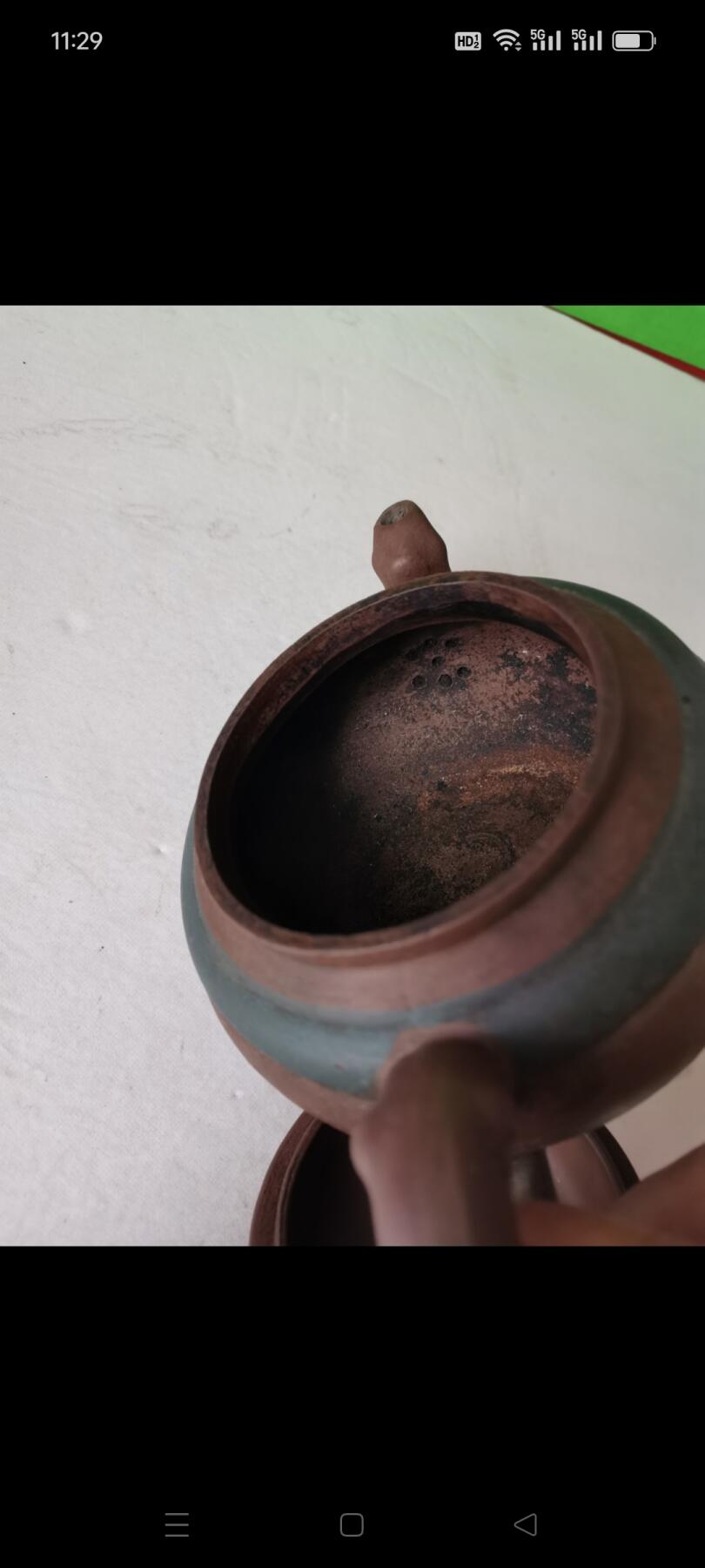 几十年前的紫砂壶1把。有画和诗词，砂质好，使用痕迹明显，完整如图包老