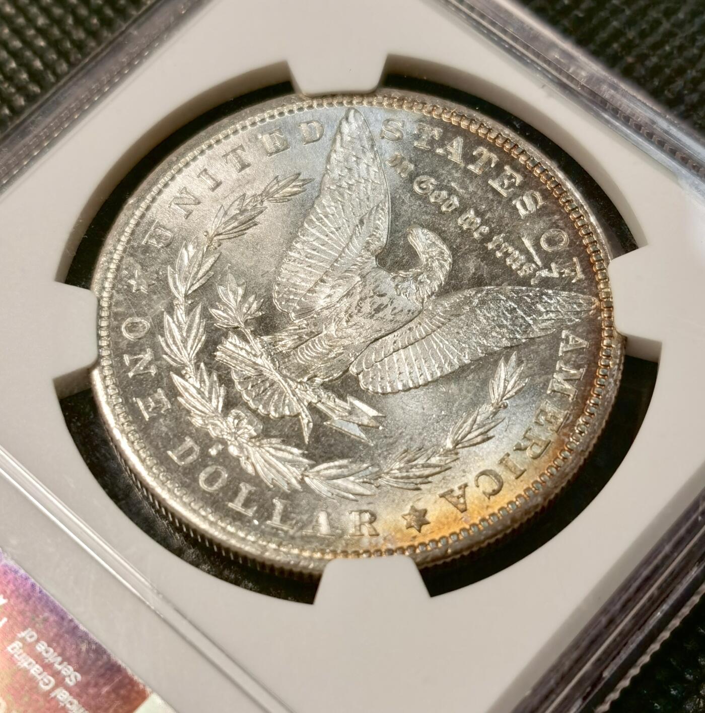 甄臻铺-世界币章拍卖（第30期），送拍享返佣金等优惠多多 NGC-MS63 美国1881年S版摩根银币，人像边缘一抹迷人的原味彩，性价比很高