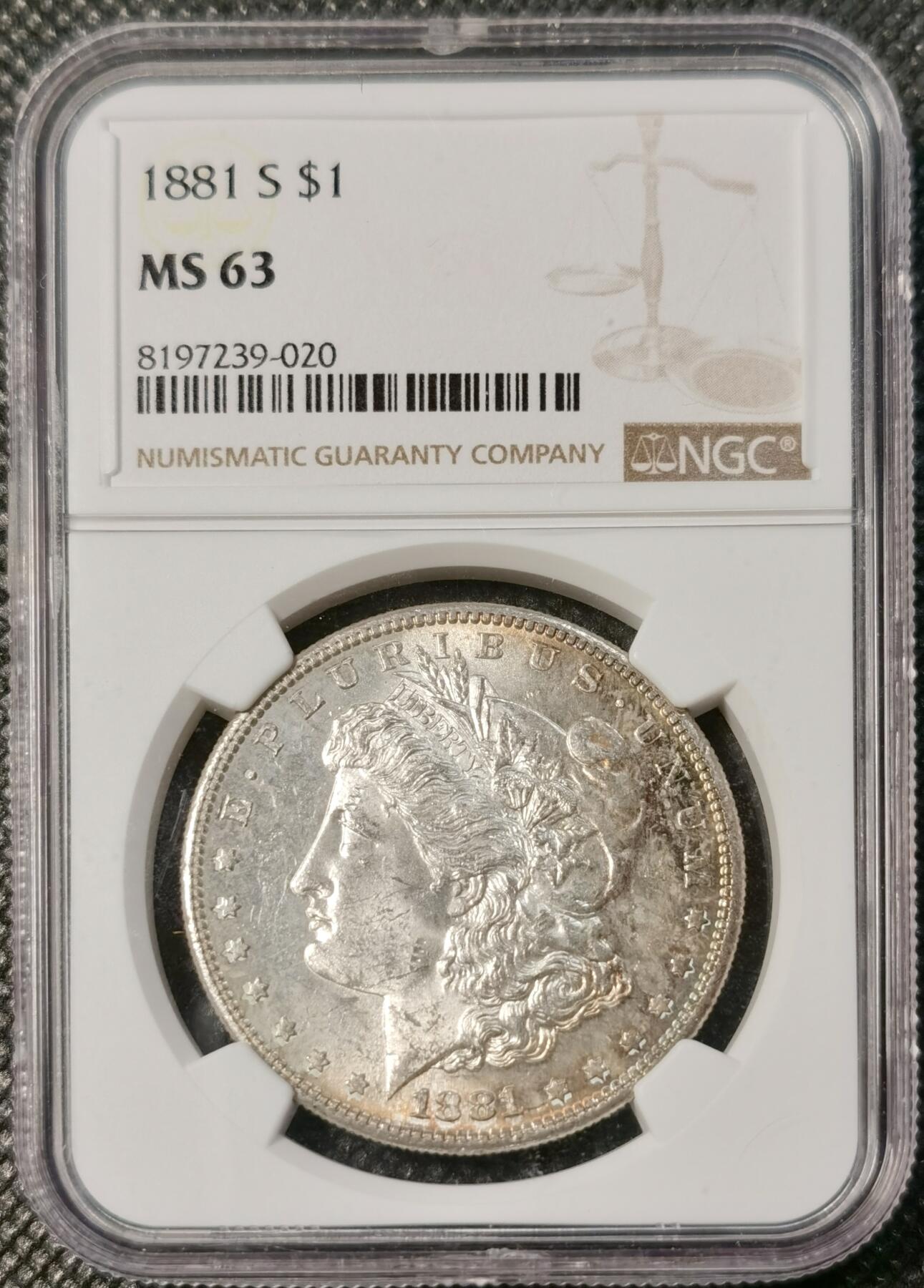 甄臻铺-世界币章拍卖（第30期），送拍享返佣金等优惠多多 NGC-MS63 美国1881年S版摩根银币，人像边缘一抹迷人的原味彩，性价比很高