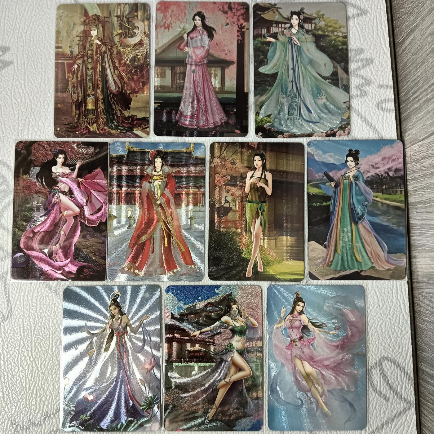 花开卡拍第35期（8月24号周日截拍，品控勿拍!!!拍品不寄存，运费5元，自制卡难免瑕疵，可能存在轻微撞角爆边等出厂瑕疵，品控介意勿拍！） 宁缺卡牌 历代皇后一套10张 粗闪 纹理特别精细 挂饰和衣服细节丰富