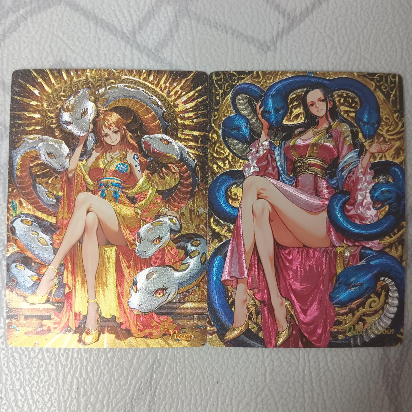 花开卡拍第35期（8月24号周日截拍，品控勿拍!!!拍品不寄存，运费5元，自制卡难免瑕疵，可能存在轻微撞角爆边等出厂瑕疵，品控介意勿拍！） 奇点卡牌 海贼王 娜美 罗宾 粗闪1对