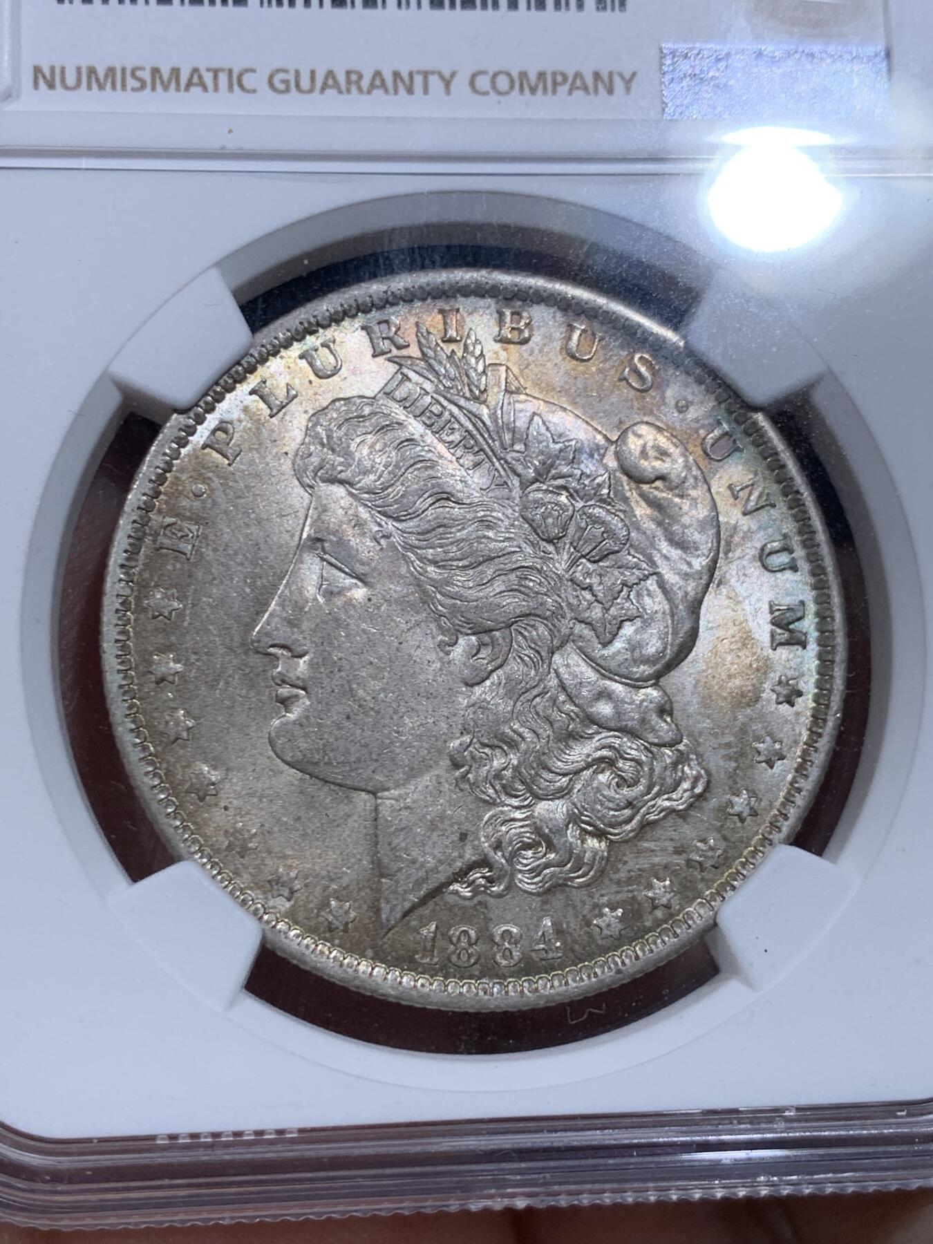 《竞宝斋》第412场 周日，周一，周二，3场连拍 （全场包邮） NGC MS62 美国1884年摩根银币，原光带彩好品 标签年份错误 N可以免费更换