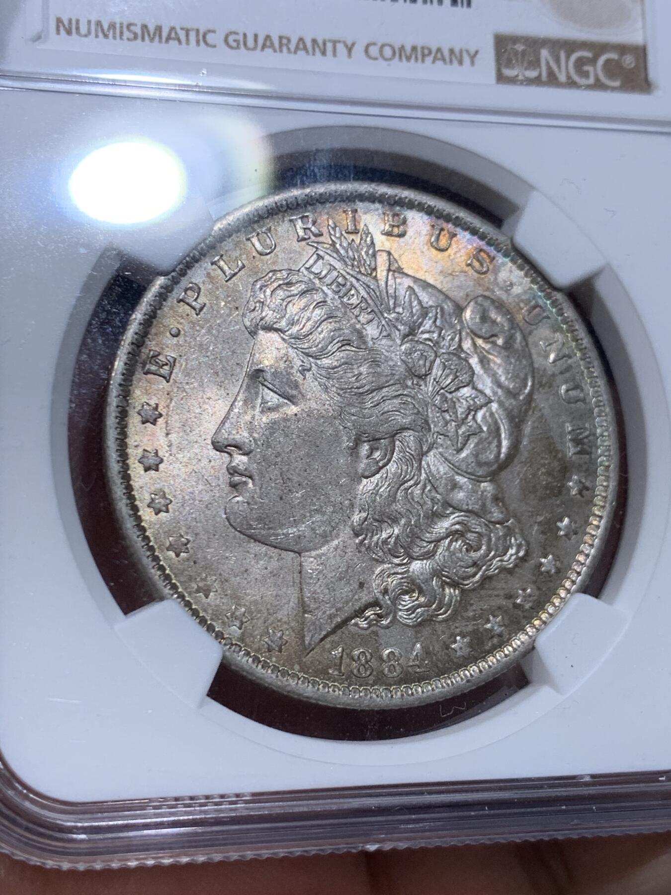 《竞宝斋》第412场 周日，周一，周二，3场连拍 （全场包邮） NGC MS62 美国1884年摩根银币，原光带彩好品 标签年份错误 N可以免费更换