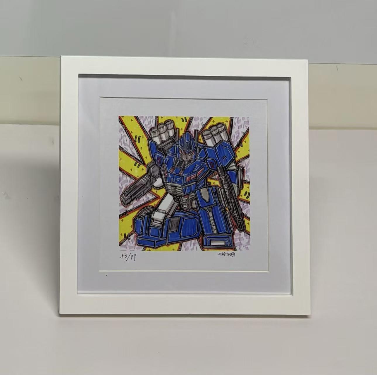 零元拍：歪歪亲笔签名 OWSON 系列作品装饰画《变形金刚》，已做装裱 木框相框尺寸28/28CM。因展品出展，镜框或亚克力可能有轻微划痕，介意勿拍