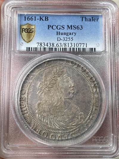 万国钱币拍卖第052期 - PCGS MS63 1661年神圣罗马帝国利奥波德一世双头鹰大泰勒 匈牙利克雷姆尼察厂铸，年轻版的利奥波德一世非常少见，此时的猪嘴特征没那么明显。此枚头发根根分明深打，背面双头鹰羽毛都清晰可见，包浆均匀原味，非常难得，PC唯一冠军顶级收藏品质。昆克23年61分成交价约2.2w人民币，另一枚还在拍卖中的63已经出到3.2w。