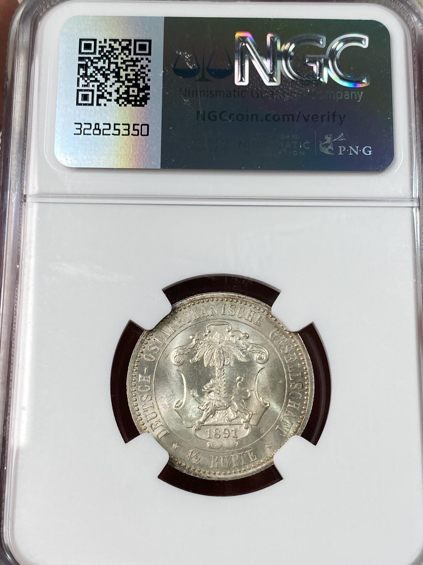 万国钱币拍卖第052期 NGC MS65 1891年德国德属东非1/2卢比银币 德属大热门品种 东非小狮子 BU原味黄油包浆十字转光