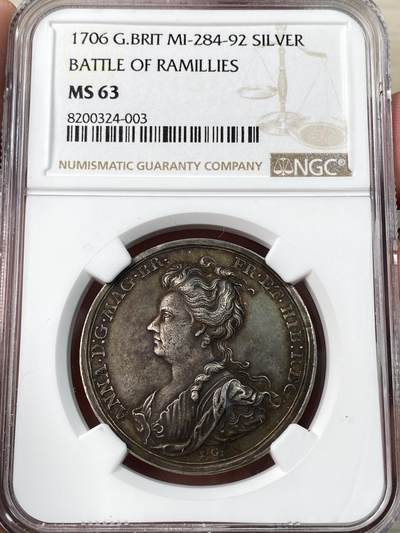 万国钱币拍卖第052期 - NGC MS63 1706年英国安妮女王纪念拉米利斯战役胜利银章， NGC唯一冠军分。