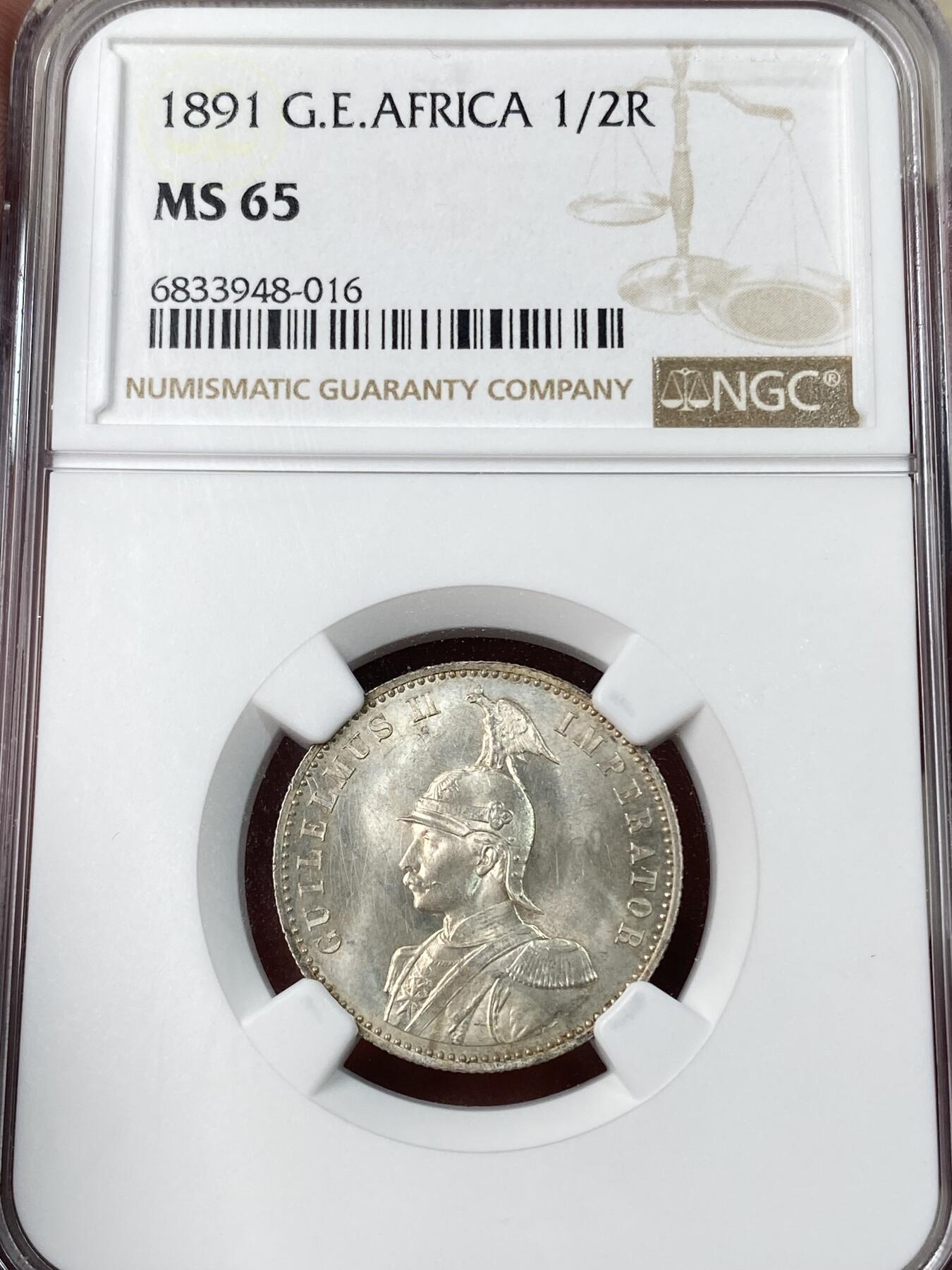 万国钱币拍卖第052期 NGC MS65 1891年德国德属东非1/2卢比银币 德属大热门品种 东非小狮子 BU原味黄油包浆十字转光