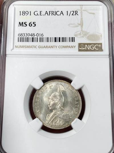 万国钱币拍卖第052期 - NGC MS65 1891年德国德属东非1/2卢比银币 德属大热门品种 东非小狮子 BU原味黄油包浆十字转光