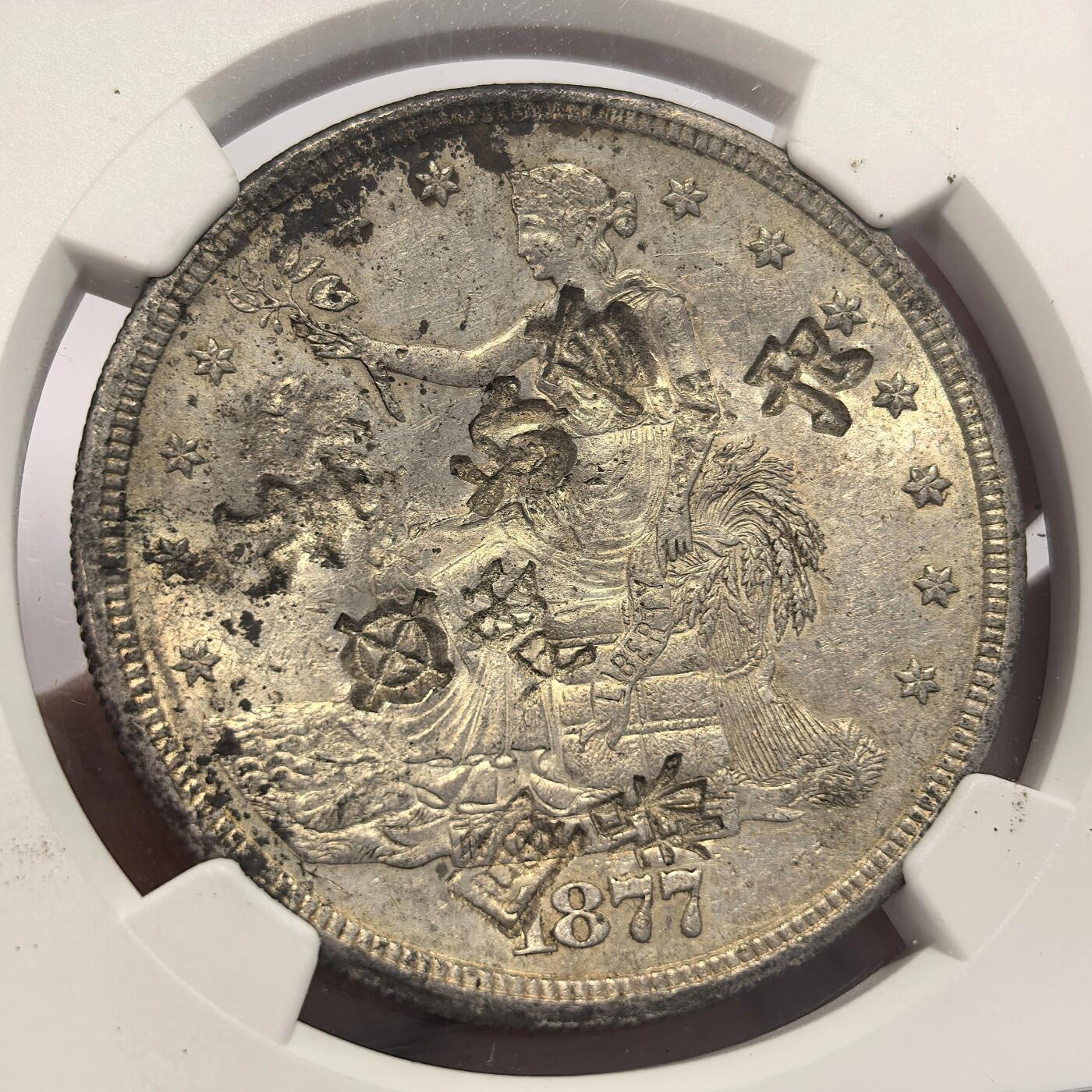 博洋堂世界钱币拍卖第136期（全场包邮） NGC CHOPMARKED 美国贸易银1877s，AU底板有多个清晰汉字戳记和画押，美国贸易银（拿花）作为晚清流入广东福建一带的银元被钱庄打戳才能使用，随着拿花被回收，这些打戳的拿花也成了历史。